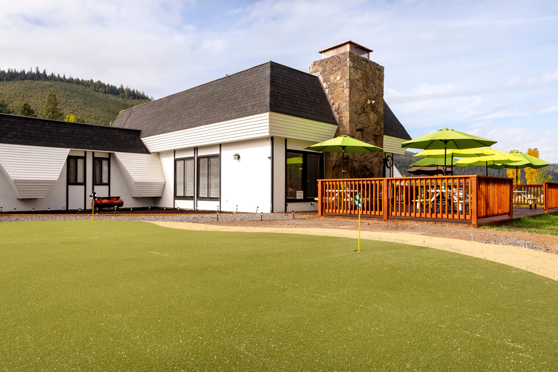 Putting green and golf clubhouse at Round Lake Community golf course Klamath Falls